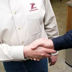 PrivacyLink team member shaking hand with business partner