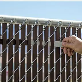 Contractor working on fence slats