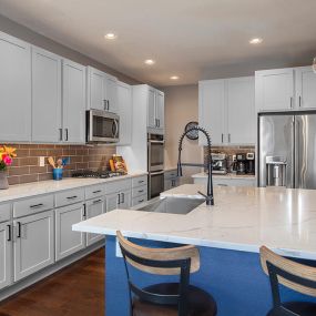 Soothing gray kitchen cabinets after cabinet painting in Naperville, IL
