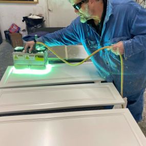N-Hance Wood Refinishing of Chicago technician performing Lightspeed technology in Des Plaines facility