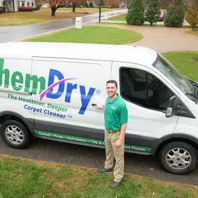 chem-dry technician standing with carpet cleaning van