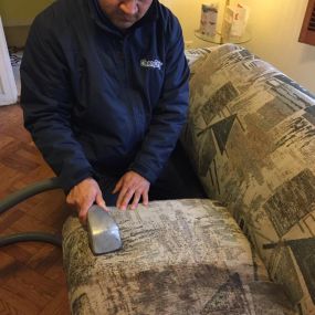 Elmer performing an upholstery cleaning in Fort Smith, AR