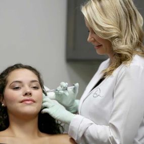 Filler is used to temporarily lift and contour cheeks, smooth lines, and plump lips. Treating with filler helps to add hydration and lift to different areas of the face and body without surgery while temporarily restoring volume loss beneath the surface.