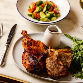 ROTISSERIE AMISH CHICKEN: crispy za'atar potatoes, arugula salad, harissa bbq