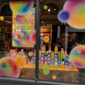 A photo of the Belfast window display for world bath bomb day.