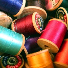 Thread
We offer an abundance of thread for any project! Shop our inventory of embroidery and cotton thread, polyester all purpose threads, Robinson Anton Thread and other notions.

We also carry threads and stabilizers along with embroidery designs.