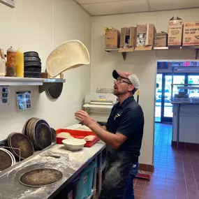 Hand-tossed dough