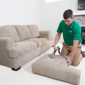 Chem-Dry service technician cleaning upholstery