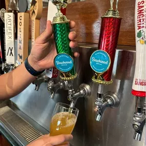 Pouring craft beer from tap by Beachwood Brewing at Pizza N' Such Claremont