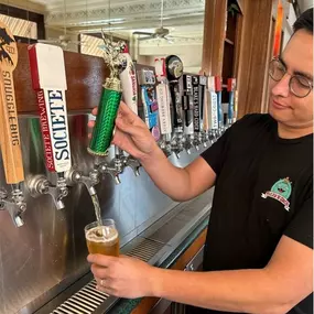 Pouring craft beer from tap at Pizza N' Such in Claremont