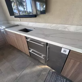 Quartz countertops with stainless appliances are good choices for outdoor projects