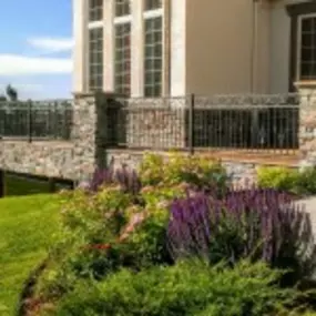 Front entry deck with custom railings and stonework