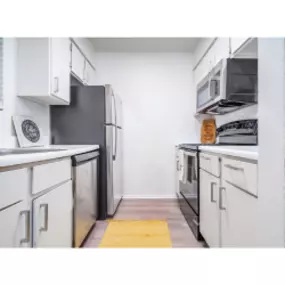 Kitchen with stainless steel/black appliances