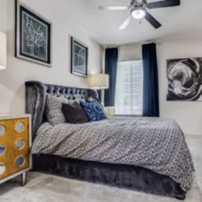 Primary Bedroom with Lush Carpet and Ceiling Fans