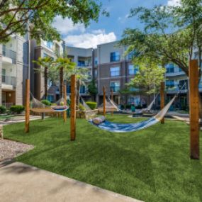 Tranquil courtyard with hammocks, fountains, and zen garden