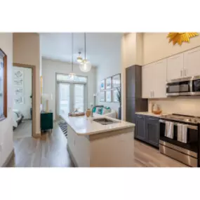 Kitchen with stainless steel appliances and quartz countertops