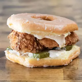 Double fried in Beef Tallow Chicken Breast, with Bread and Butter Sweet and Spicy Pickles, Coop Sauce, on a yeast-raised Double Glazed Donut! Only available in 7oz Chicken Breast.