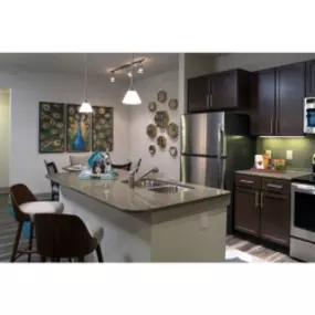 Kitchen with stainless steel appliances with kitchen island