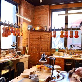 A Cello being repaired by Samuel Payton, in the workshop of Payton Violins