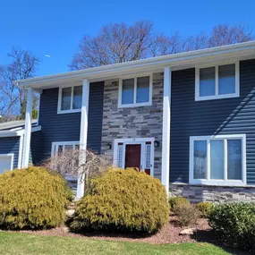 New vinyl siding and stone replacement