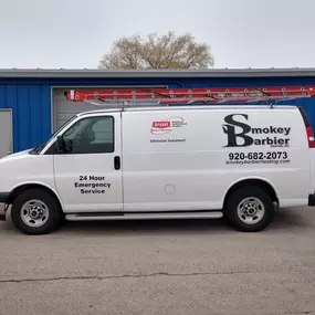 Smokey Barbier Heating Inc van outside of the building