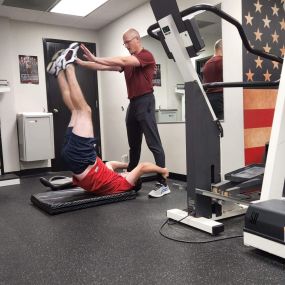 Resistance leg raises for core training