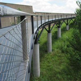 Stainless steel cable mesh railings for pedestrian bridge safety by Carl Stahl DecorCable.