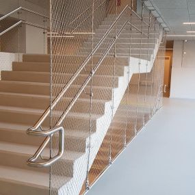Stainless steel cable mesh system for stair safety and fall protection by Carl Stahl DecorCable.