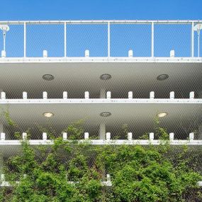 Stainless steel cable mesh green wall facade for parking garage safety and fall protection by Carl Stahl DecorCable.