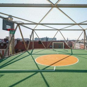 Stainless steel cable mesh rooftop playground enclosure for safety and fall protection by Carl Stahl DecorCable.