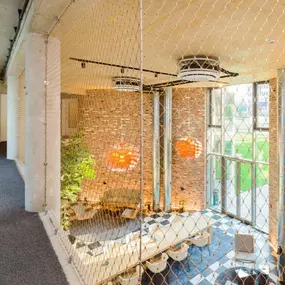 Stainless steel cable mesh indoor safety partition for fall protection by Carl Stahl DecorCable.