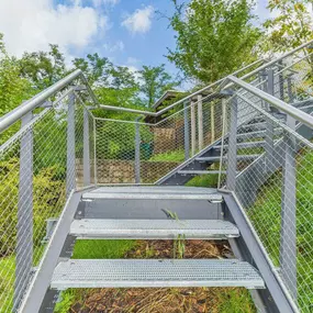 Stainless steel cable mesh railing system for stairs and walkways by carl Stahl DecorCable.