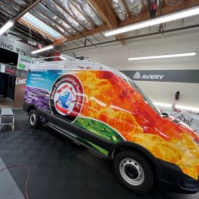Dwraps installing a commercial vinyl wrap job onto a company van for a client