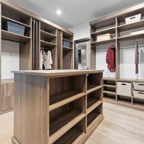 A large closet with an island in the center
