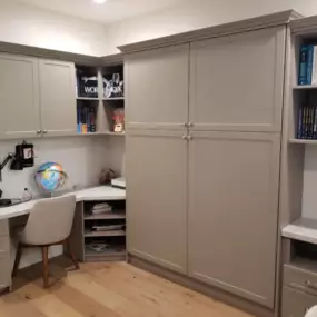 A vaulted ceiling closet with custom shelving and hang space