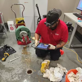 Technician Raymond taking photos on the job to ensure the job is thoroughly documented for the customer