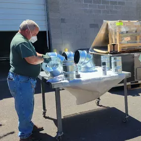 Trusted expertise in action. Our Central Oregon Heating, Cooling, Plumbing & Electrical technician carefully prepares ductwork to ensure lasting comfort for Bend homes.