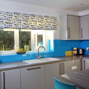 Fresh fabrics and creative colours in this kitchen blind from Norwich Sunblinds