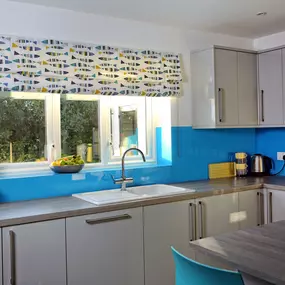 Fresh fabrics and creative colours in this kitchen blind from Norwich Sunblinds