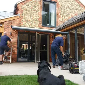 Here's Dan working with Matt to install a stunning  Fold Arm Awning  for a customer