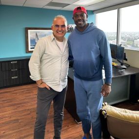 Terrell Owens and Dr. Igal Elyassi at Wilshire Smile Studio