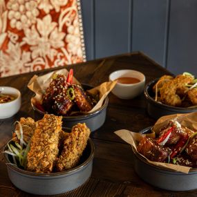 Bar Snacks. Crispy king prawns, tandoori mayonnaise, Chicken wings, in a sticky Asian sauce, Panko-coated halloumi sticks, Pork belly bites, spicy apple sauce, Southern-fried chicken strips