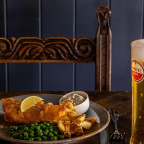 Beer-battered fish and chips, homemade tartare sauce with a choice of garden or mushy peas.