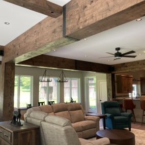 This home is wrapped in Oak faux Wood Beam Wraps. Beautiful Wood Ceiling Beams 
that are custom built to building specs.