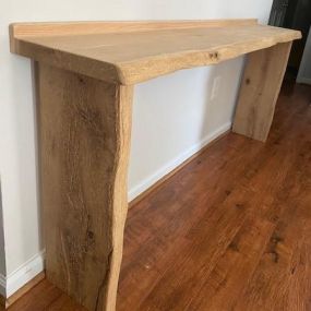 Custom built hall table using reclaimed wood.  Live edge boards and sealed with satin finish,white oak