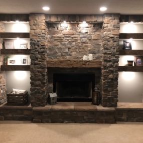Putting 6 of these 3 inch Reclaimed wood shelves that are laid between this amazing stone work, done by home owner!
And they chose an old Reclaimed Barn Beam for their Fireplace Mantel.. Nice job!