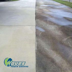 Waves Power Washing power washing a concrete driveway in Hampstead, NC for a customer.