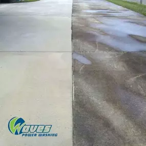 Waves Power Washing power washing a concrete driveway in Hampstead, NC for a customer.