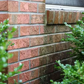 Waves Power Washing performing brick cleaning on a house in Hampstead, NC.