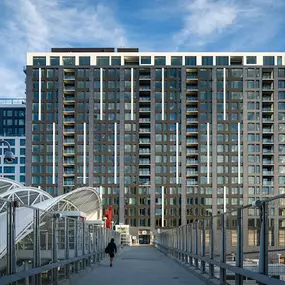 The Coloradan is a striking residential building located in the heart of Downtown Denver. This modern high-rise features a combination of sleek glass and brick facades, blending contemporary design with a warm, inviting aesthetic. Home to luxury condominiums, the building offers stunning views of the Rocky Mountains and the Denver skyline. Its prime location provides easy access to local amenities, dining, and cultural attractions, making it a desirable place for urban living. The Coloradan also